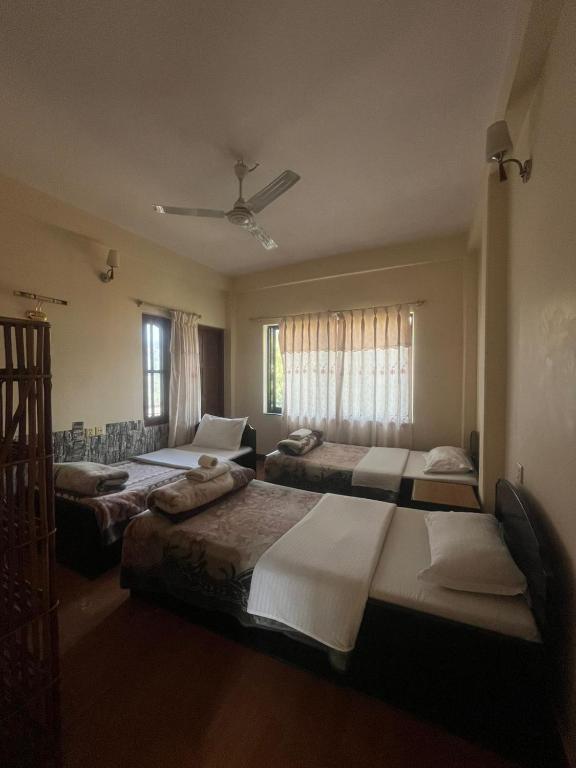 Letto o letti in una camera di Cherry Garden Pokhara
