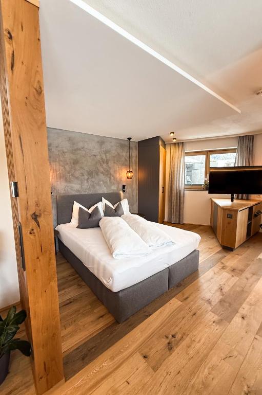 Postel nebo postele na pokoji v ubytování Cabin8 Alpine Flair Apartments