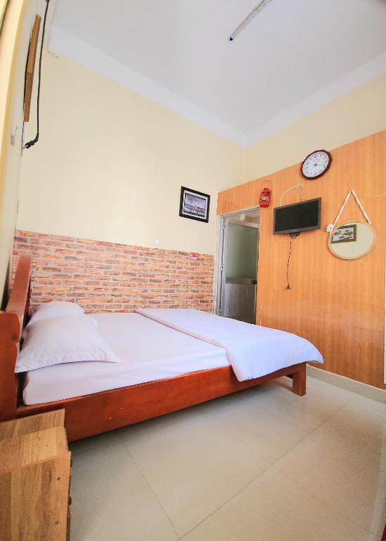 Postel nebo postele na pokoji v ubytování Bình Đào Hotel - Khách sạn ngay trung tâm giá rẻ