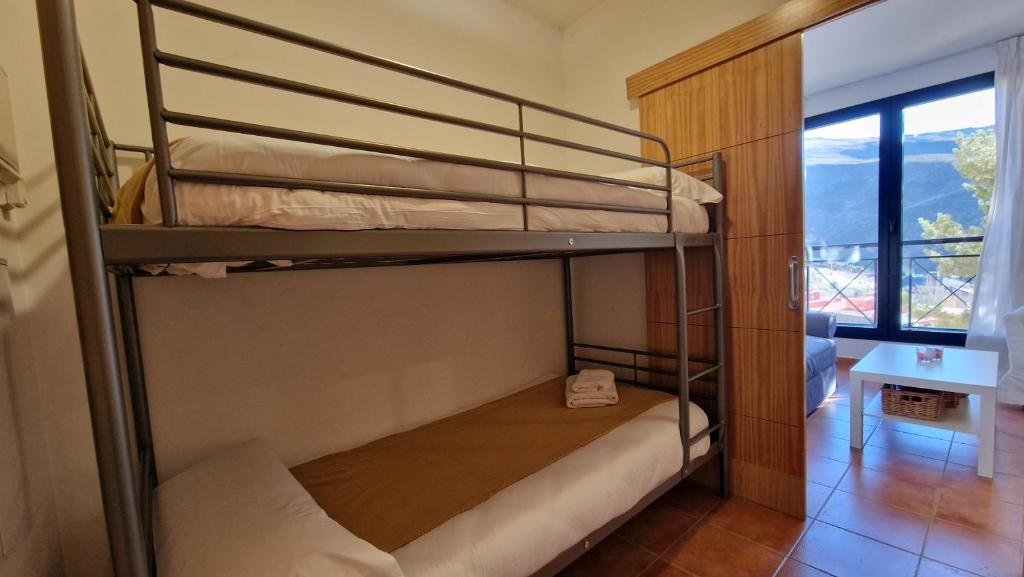 Łóżko lub łóżka w pokoju w obiekcie IMEDA Apartamentos MONTE GORBEA