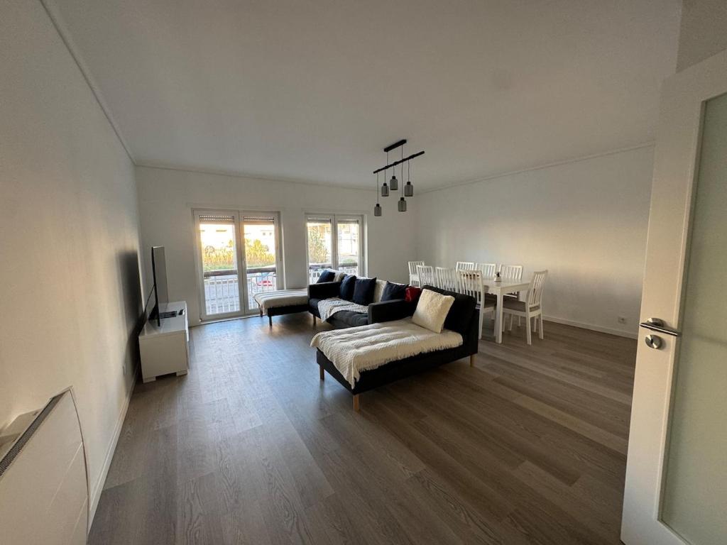 a living room with a couch and a table at Vagueira Apartment in Praia da Vagueira