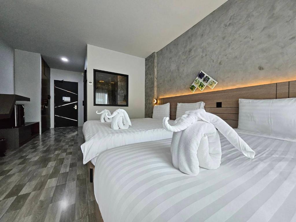 Postel nebo postele na pokoji v ubytování Little Loft Hotel