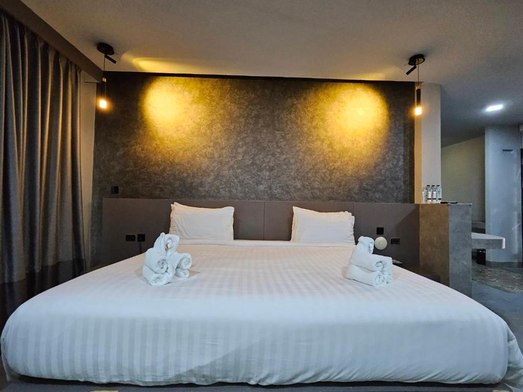 Postel nebo postele na pokoji v ubytování Little Loft Hotel