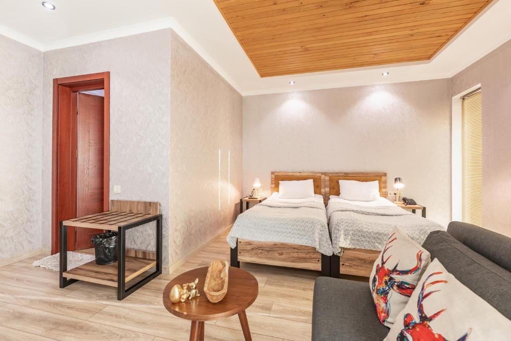 Postel nebo postele na pokoji v ubytování Hotel Gold Tower