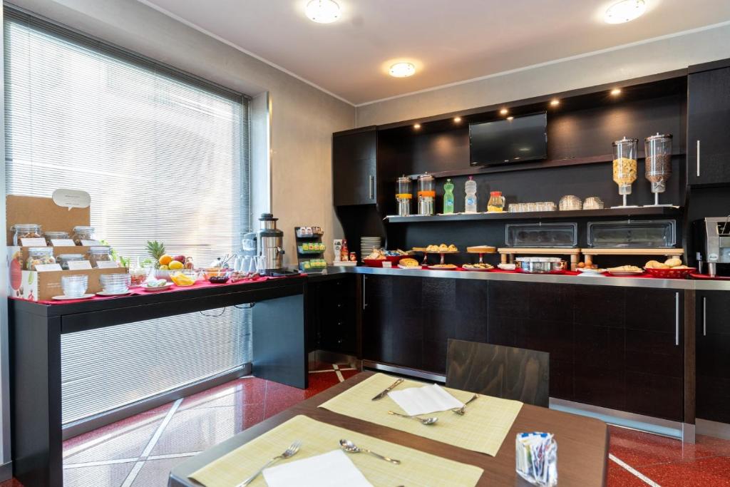 Kuchyň nebo kuchyňský kout v ubytování Hotel Majorana