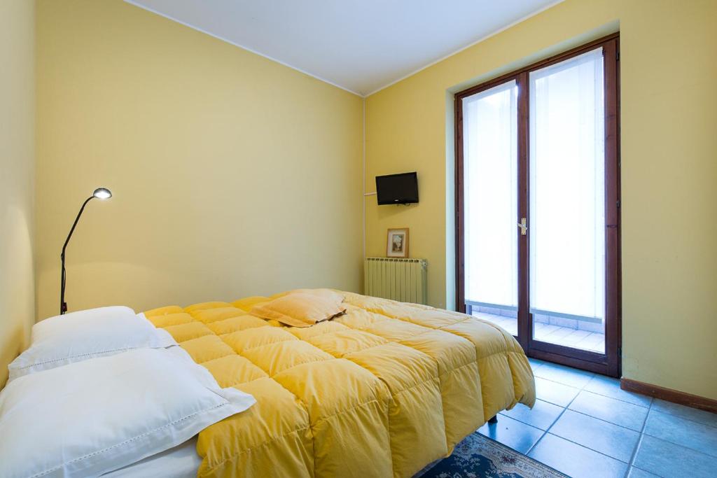 A bed or beds in a room at Ca' del Bosco