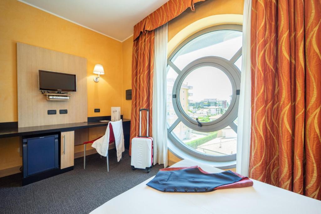 Postel nebo postele na pokoji v ubytování Hotel Majorana