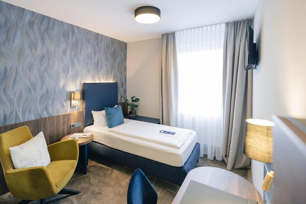 Postel nebo postele na pokoji v ubytování Hotel & Restaurant Rose