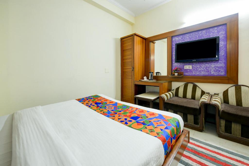 Postel nebo postele na pokoji v ubytování Hotel Paradise - New Delhi