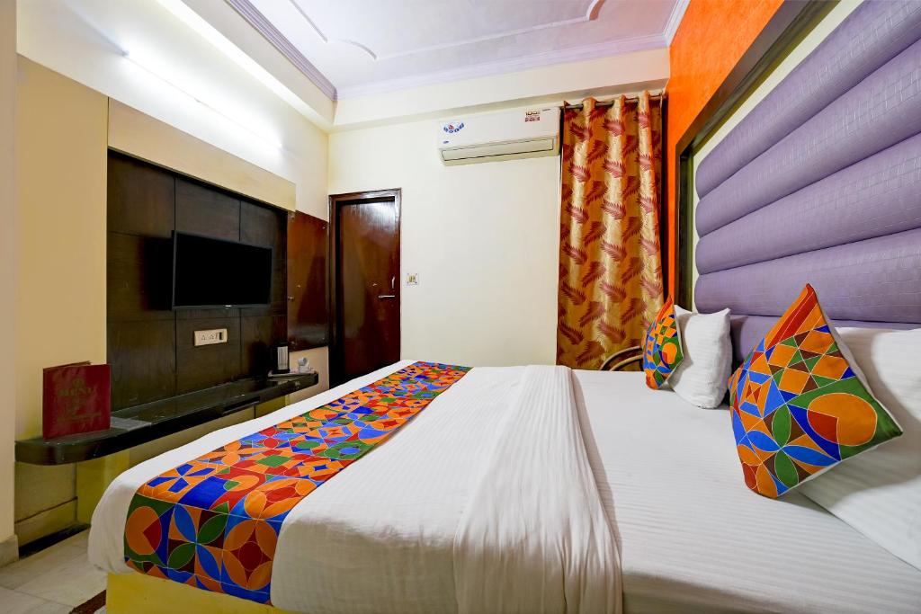 Postel nebo postele na pokoji v ubytování Hotel Paradise - New Delhi