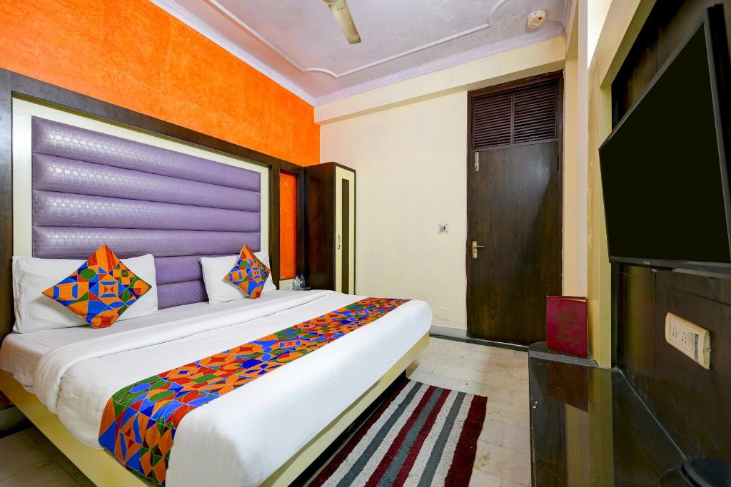 Postel nebo postele na pokoji v ubytování Hotel Paradise - New Delhi