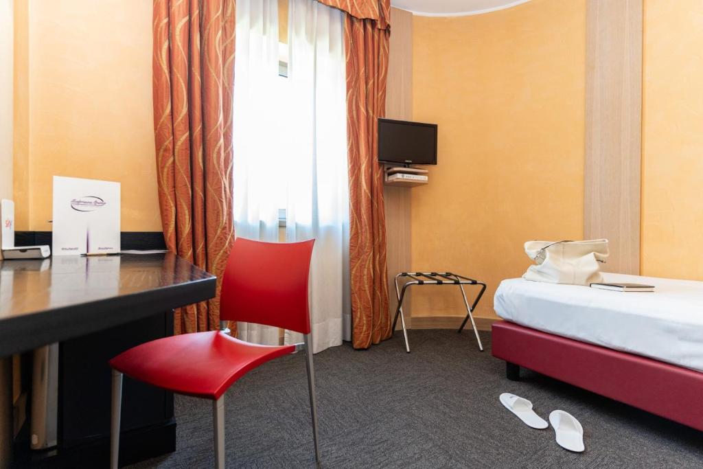 Postel nebo postele na pokoji v ubytování Hotel Majorana