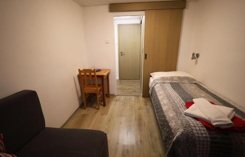 Postel nebo postele na pokoji v ubytování BILÍKOVA CHATA - Horský hotel