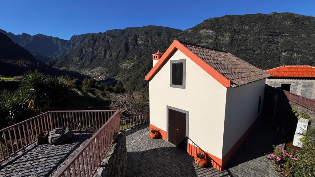 a small chapel with a view of the mountains at Casa dos Lamaceiros in São Vicente