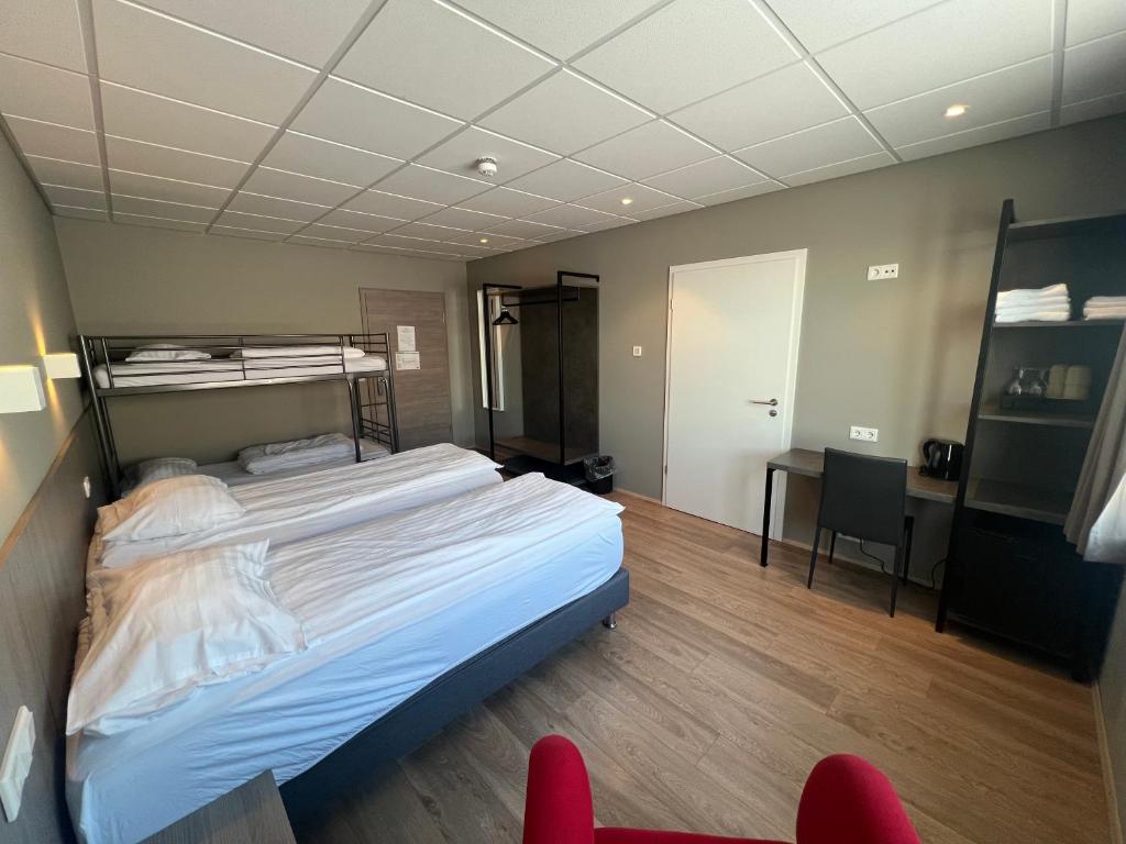 Postel nebo postele na pokoji v ubytování Vagnsstadir Guesthouse