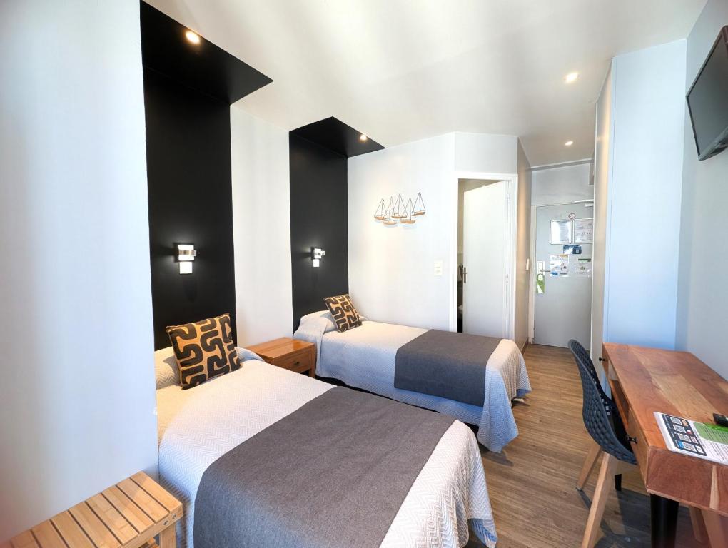 TV a/nebo společenská místnost v ubytování H33 Hôtel