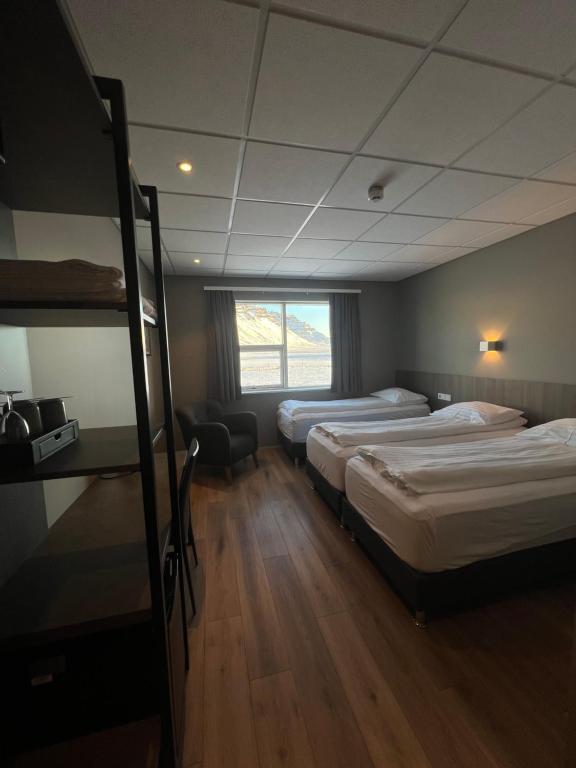Postel nebo postele na pokoji v ubytování Vagnsstadir Guesthouse