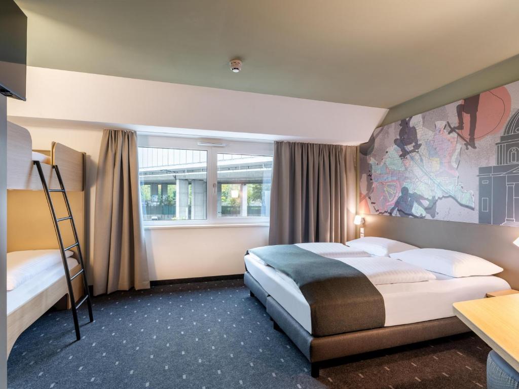 Postel nebo postele na pokoji v ubytování B&B HOTEL Wien-St-Marx