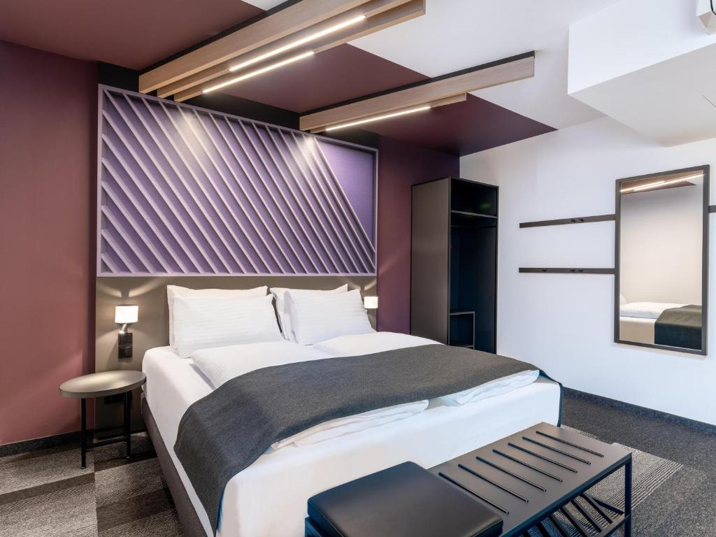 Postel nebo postele na pokoji v ubytování B&B HOTEL Wien-St-Marx