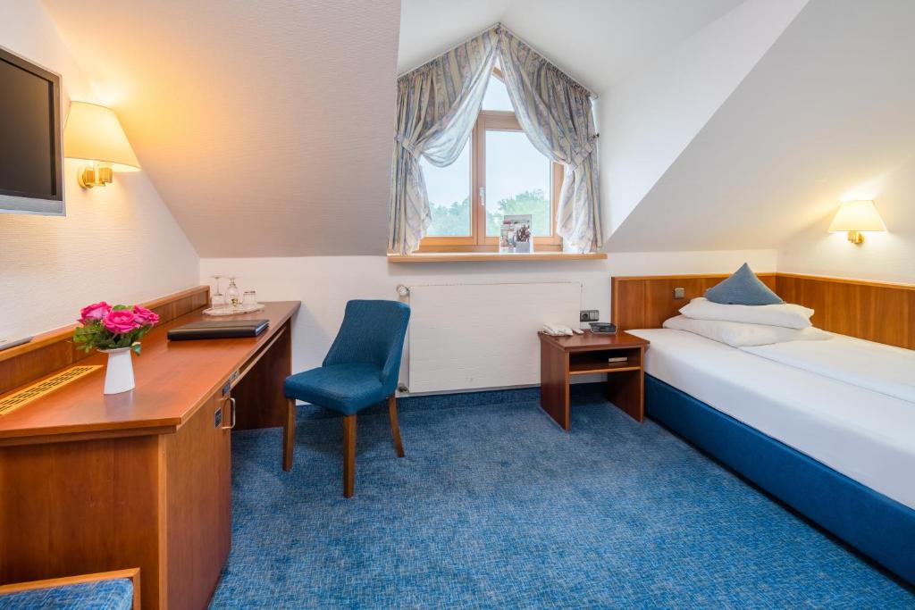 Postel nebo postele na pokoji v ubytování Best Western Blankenburg Hotel