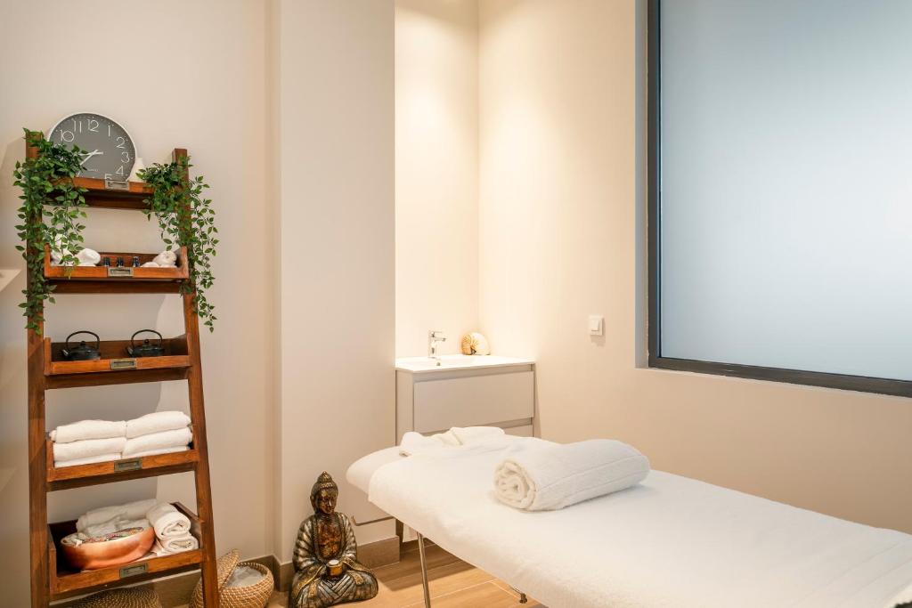 a room with two beds and a mirror at INNSiDE by Meliá Alicante Porta Maris in Alicante