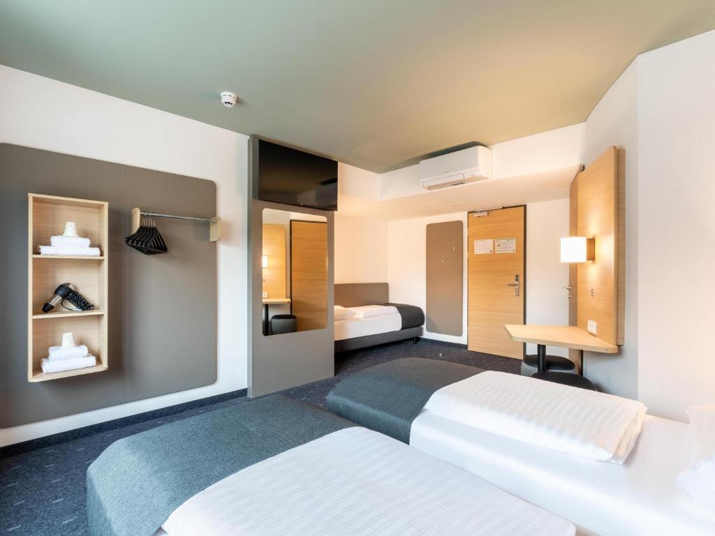 Postel nebo postele na pokoji v ubytování B&B HOTEL Wien-St-Marx