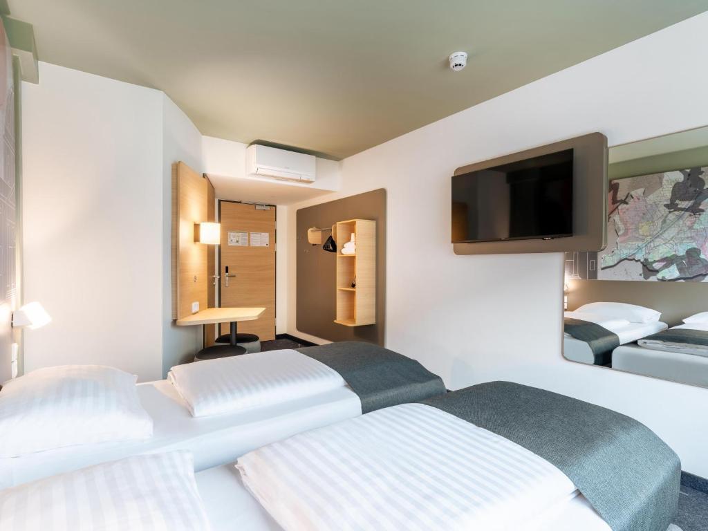 Postel nebo postele na pokoji v ubytování B&B HOTEL Wien-St-Marx