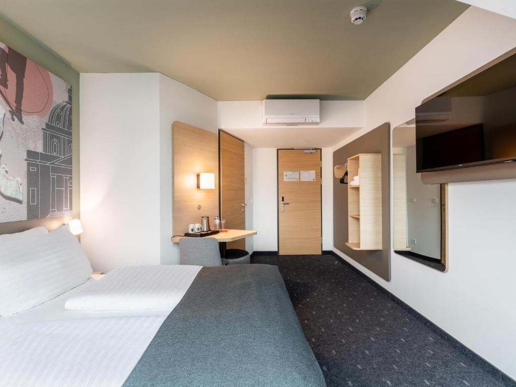 Postel nebo postele na pokoji v ubytování B&B HOTEL Wien-St-Marx