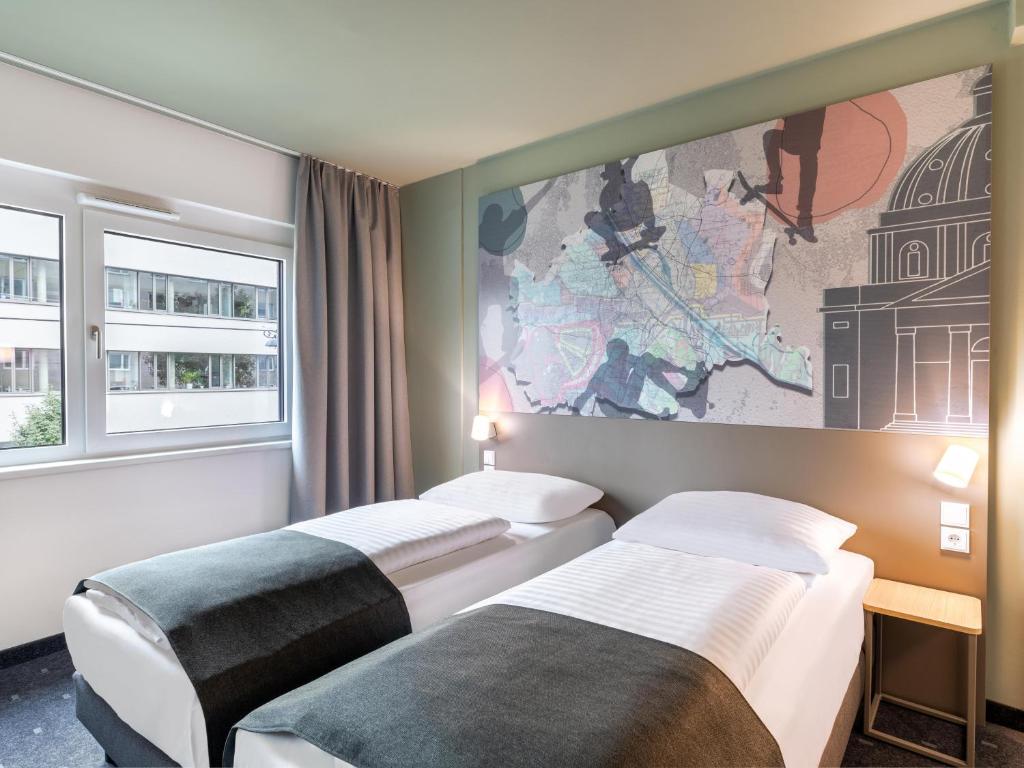 Postel nebo postele na pokoji v ubytování B&B HOTEL Wien-St-Marx