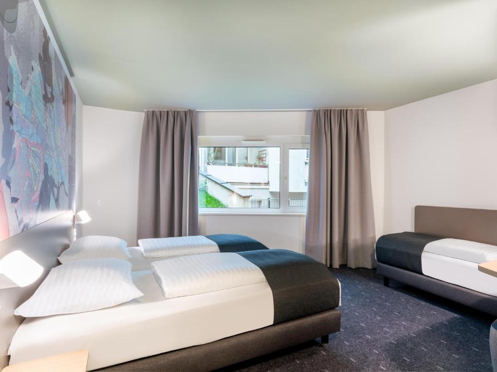 Postel nebo postele na pokoji v ubytování B&B HOTEL Wien-St-Marx