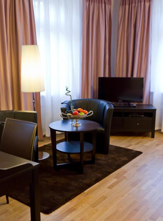 TV a/nebo společenská místnost v ubytování Suiten Hotel Dependance Laterne