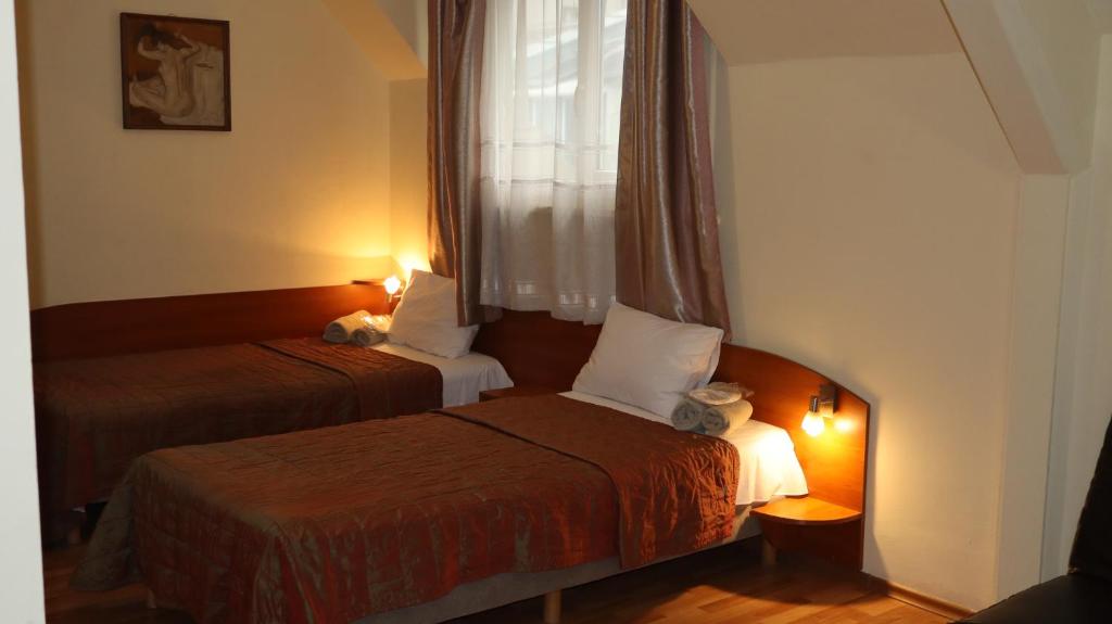 Ένα ή περισσότερα κρεβάτια σε δωμάτιο στο Hotel Palitra