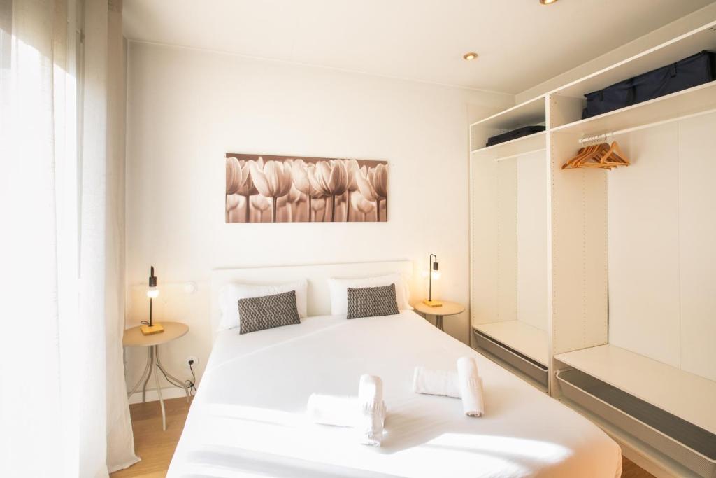 Posteľ alebo postele v izbe v ubytovaní 42ara1026 - Spacious apartment in Eixample