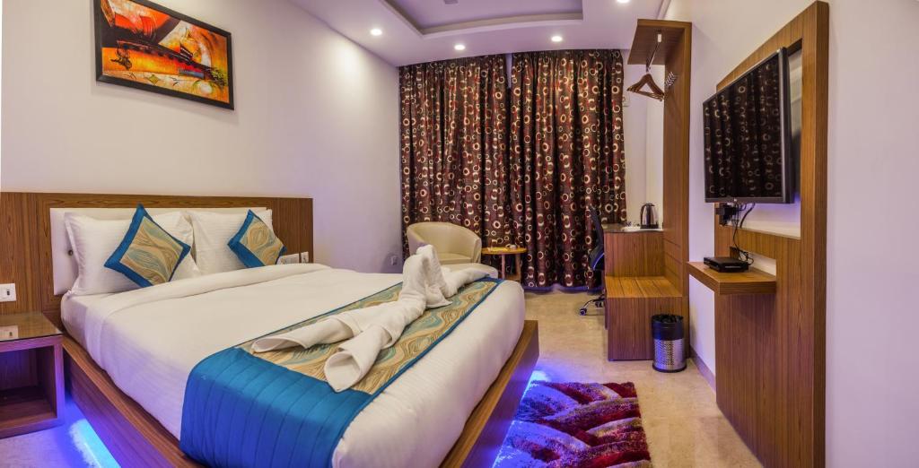 Postel nebo postele na pokoji v ubytování Hotel Suktara International