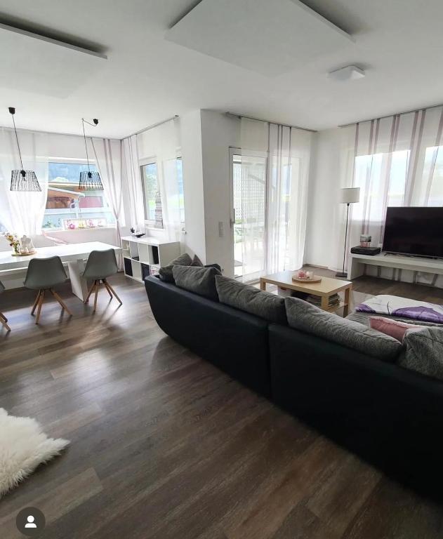 a large living room with a couch and a table at Ferienhaus Mölltal in Penk