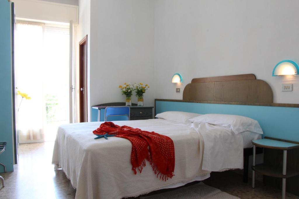 Postel nebo postele na pokoji v ubytování Hotel Confort