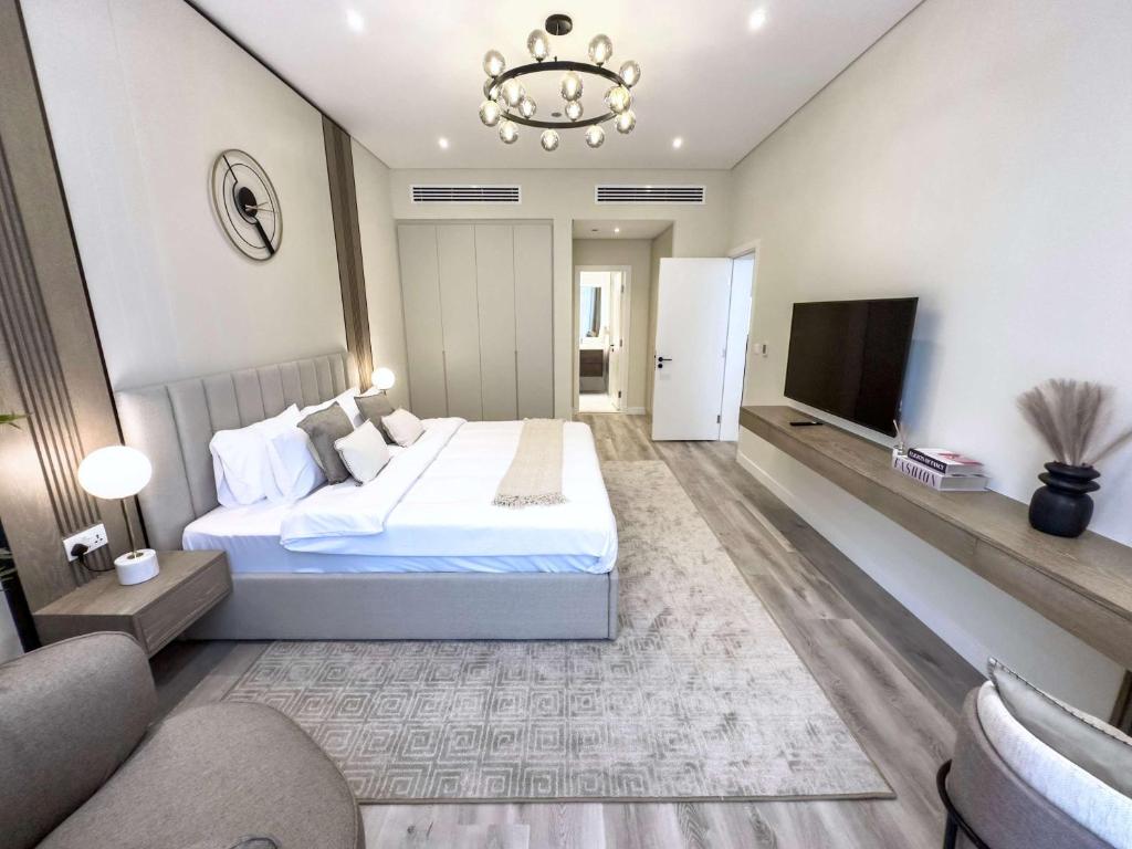 Una cama o camas en una habitación de Luxury 1BR Suite with Direct Burj Al Arab View