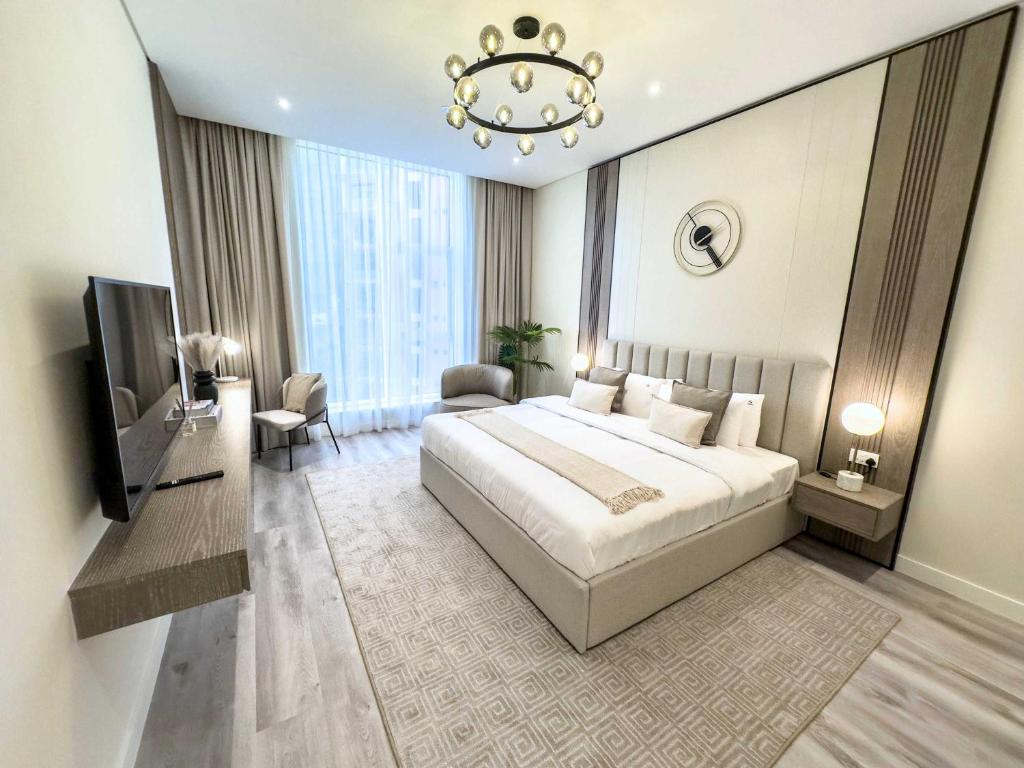 Una cama o camas en una habitación de Luxury 1BR Suite with Direct Burj Al Arab View