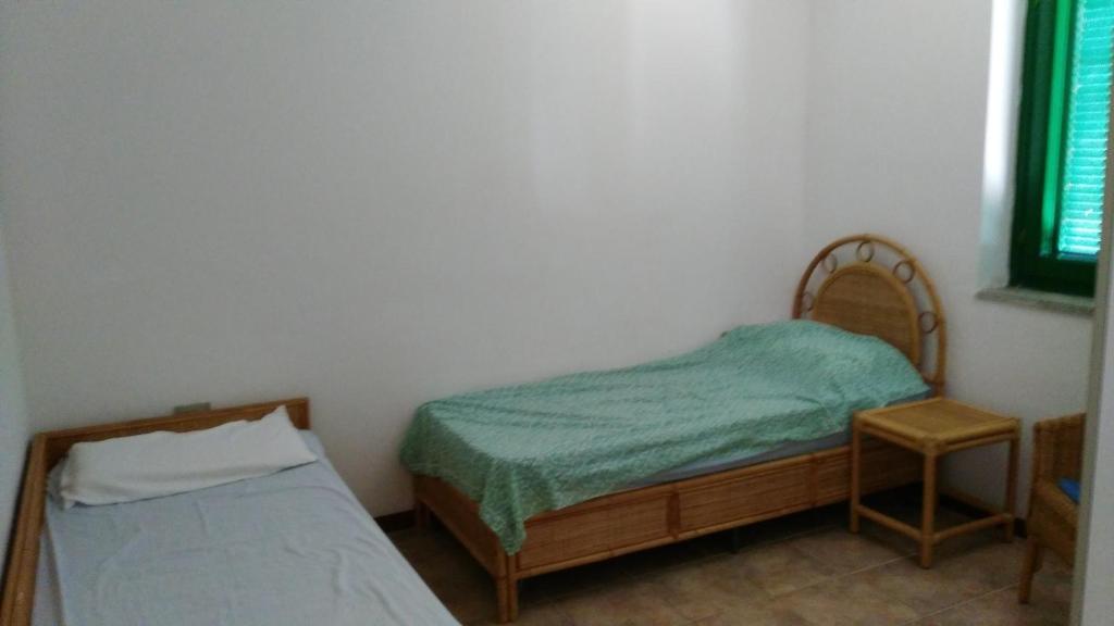 A bed or beds in a room at Borgo Le Logge