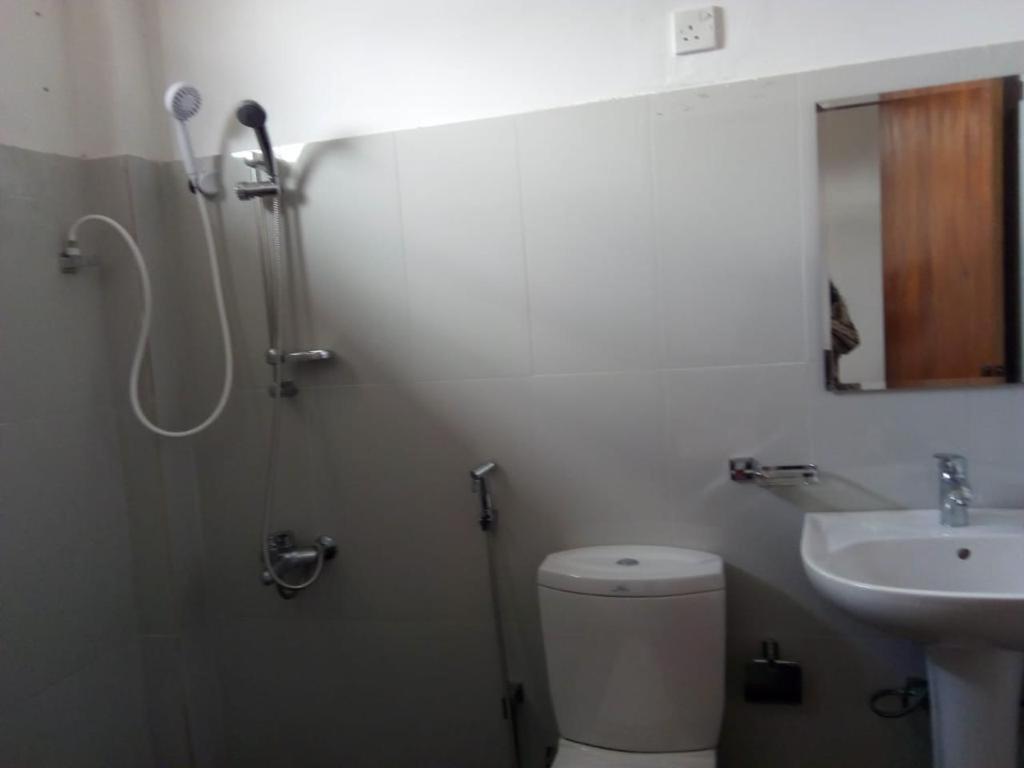Koupelna v ubytování Jayamasa Lucy Home