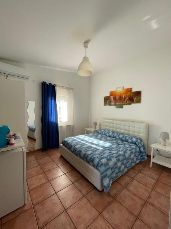 Postel nebo postele na pokoji v ubytování Scibetta's B&B