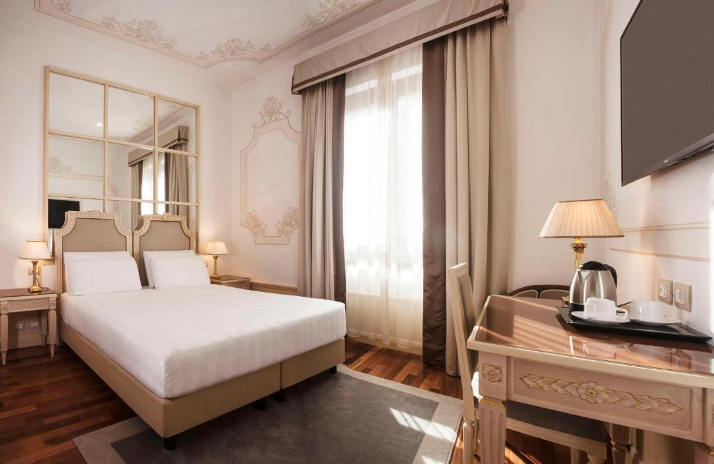 Letto o letti in una camera di Radisson Blu GHR Rome