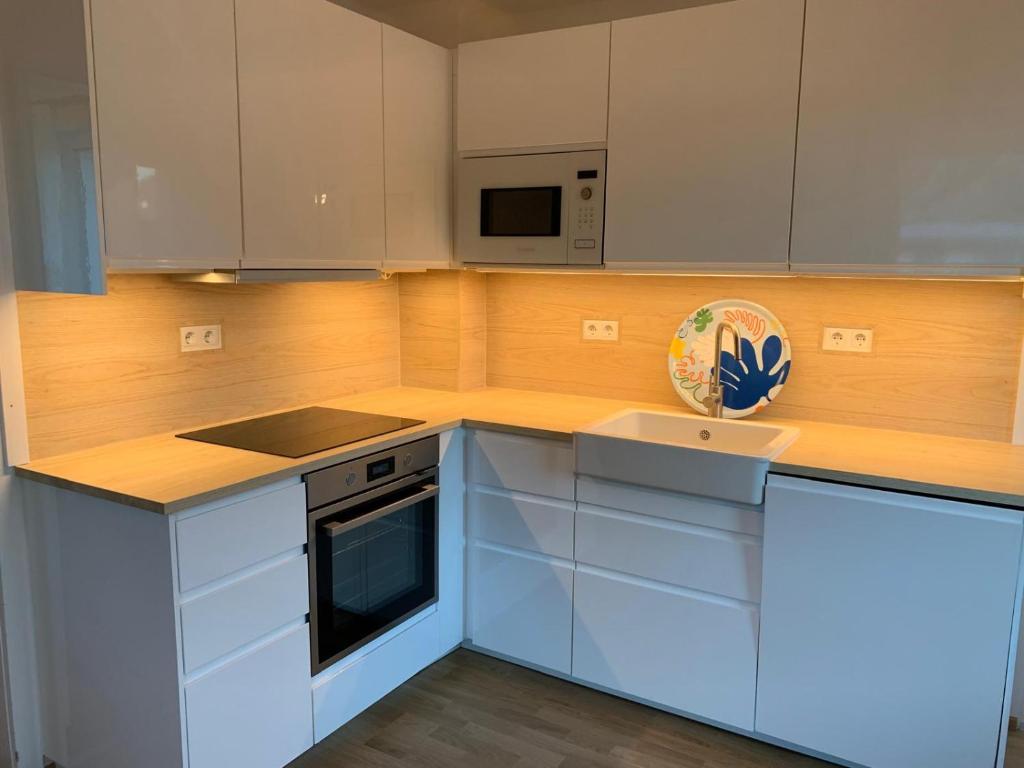 Kuchyň nebo kuchyňský kout v ubytování Dorfappartements ALLEE 11