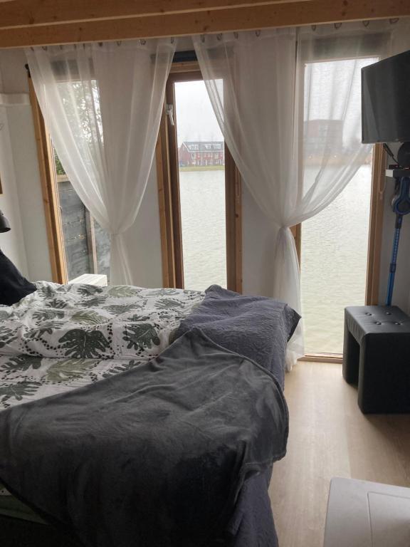 Postel nebo postele na pokoji v ubytování Bed & Breakfast ‘t Westergouwertje