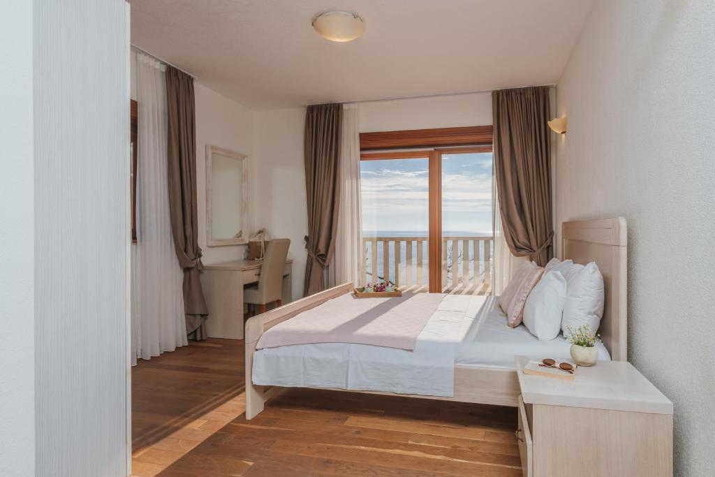 Postel nebo postele na pokoji v ubytování Apartments Pietra Mare