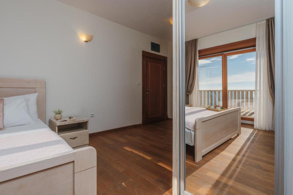 Postel nebo postele na pokoji v ubytování Apartments Pietra Mare