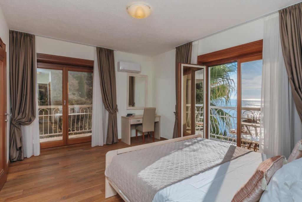 Postel nebo postele na pokoji v ubytování Apartments Pietra Mare