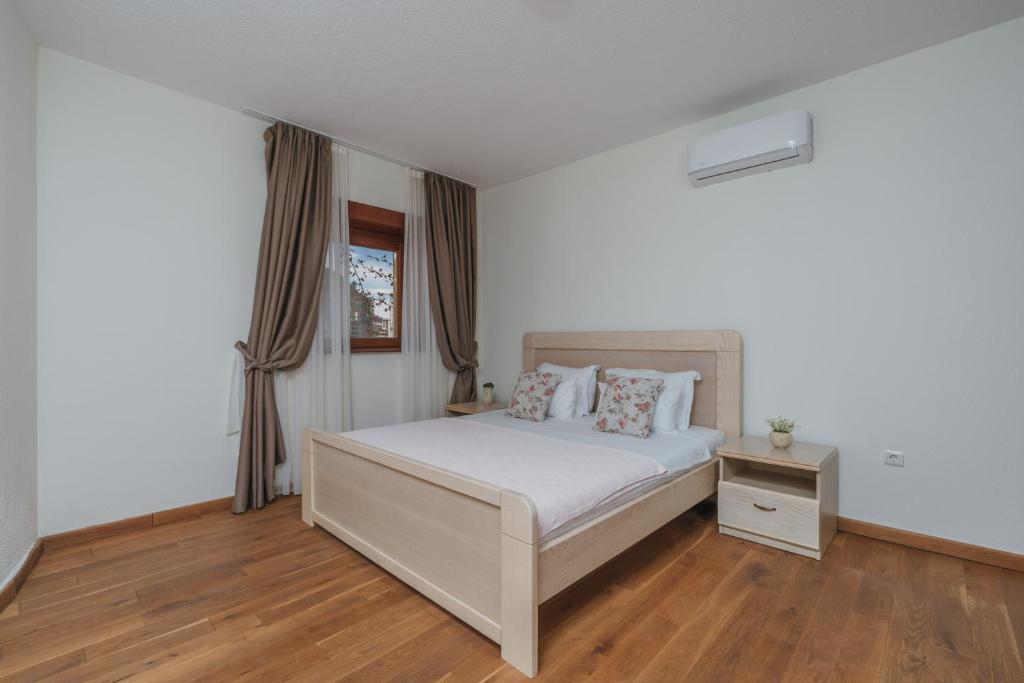Postel nebo postele na pokoji v ubytování Apartments Pietra Mare