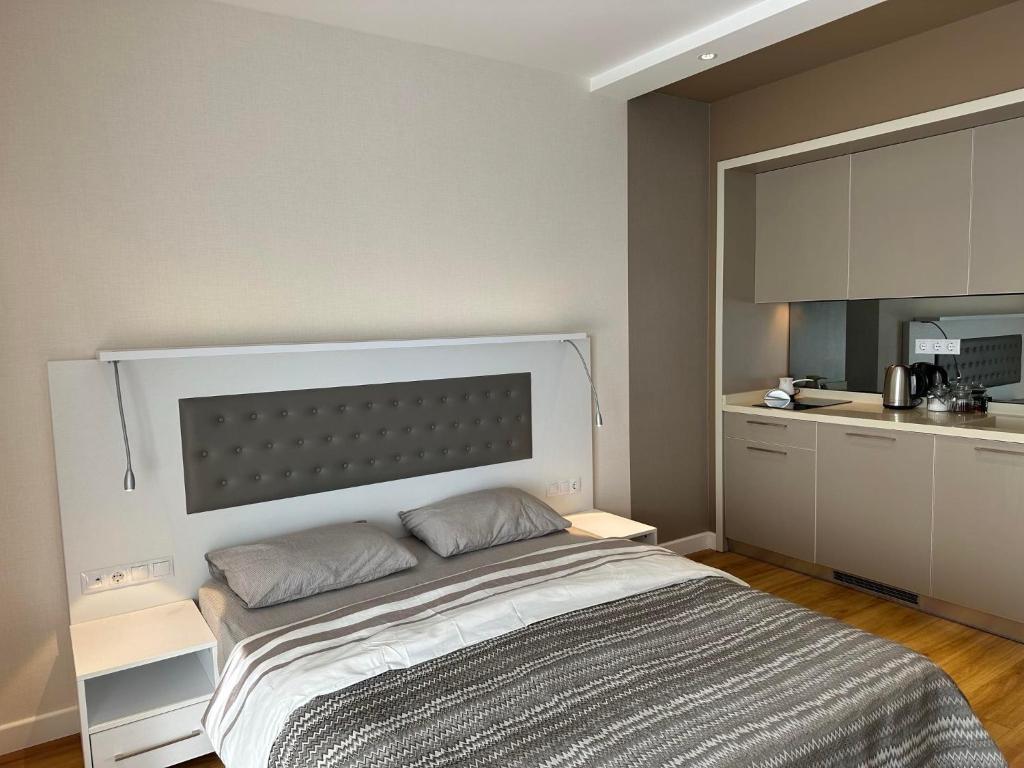 Postel nebo postele na pokoji v ubytování 5 Star Hotel Apartments