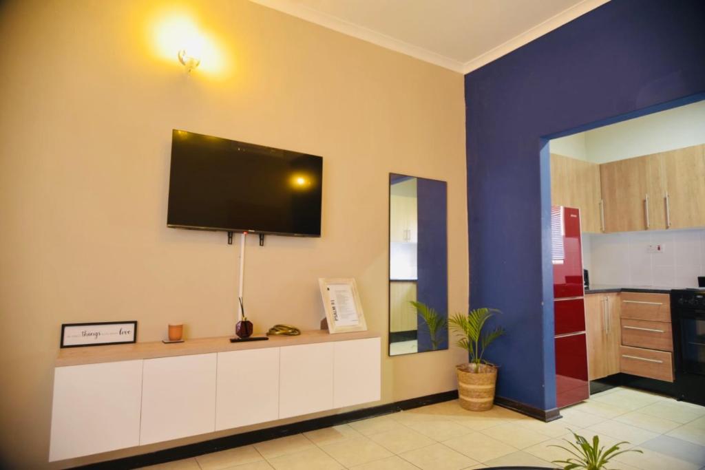 TV a/nebo společenská místnost v ubytování R&R Stays